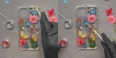 a person in black gloves is painting flowers and butterflies on their phone cases