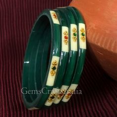 BEAUTIFUL GLASS BANGLE *  Main Color : Green * Skin Friendly : This Product does not contain harmful constituents. Anti-allergic safe for Skin. * Quality : Made from Premium Quality Material. This Product assures to remain in its Original Glory even after several usages.     . Actual Images of item are shown above, Please be aware of the actual colors may vary from the color shown on your screen, as monitor    settings may vary from individual to individual. . Welcome to Our Etsy Store! We are g Plastic Round Jewelry For Parties, Round Plastic Party Jewelry, Green Plastic Round Bead Jewelry, Adjustable Green Bangle For Celebration, Green Round Beads Bracelets For Wedding, Adjustable Green Bracelet For Celebration, Green Round Bead Bracelets For Wedding, Adjustable Green Bracelets For Celebration, Elegant Plastic Jewelry For Parties