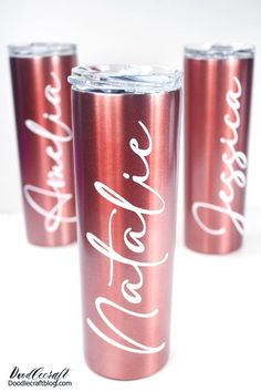 three red tumblers with white lettering on them