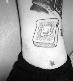 a black and white photo of a toaster tattoo