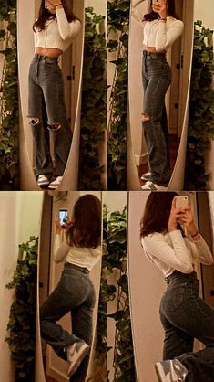 a woman taking a selfie in the mirror with her cell phone and wearing ripped jeans