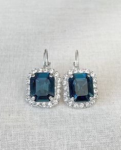 Gorgeous earrings done with Swarovski emerald cut crystals in a beautiful navy blue, surrounded with a halo of tiny sparkling clear crystals. 3/4 inch wide x a little over 1 inch long.   The navy blue crystal is 12x10mm.  Thanks for stopping by! Blue Emerald Cut Earrings For Formal Occasions, Blue Halo Setting Earrings For Wedding, Emerald Cut Halo Setting Earrings For Wedding, Emerald Cut Halo Setting Wedding Earrings, Emerald Cut Halo Earrings For Wedding, Emerald Cut Wedding Earrings, Areca Nut, Bridesmaid Earring, Blue Bridal Earrings