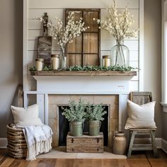 a living room filled with furniture and a fire place covered in flowers on top of a mantle