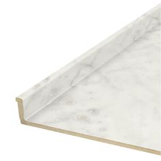 a white marble counter top with gold trimmings on the edges and bottom edge