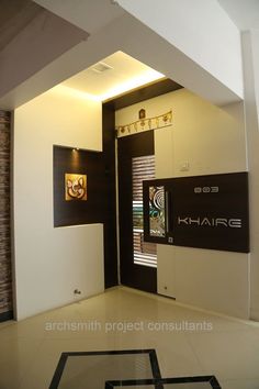 the entrance to an office building with black and white decor