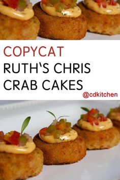 crab cakes are topped with mustard and garnish