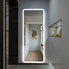 an open door leading into a white room