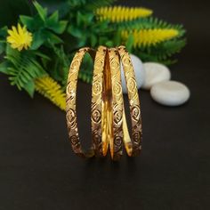 Set of Four Bangles, Thick Gold Bangles, Bridal Bangle Set, Indian Bangle Set, Metal Bangles, Traditional Wedding Jewelry, Staking Bangle Bracelet, Gold Bangle Bracelet Set, Gold Bangle Bracelet Vintage, Gold Bangles 14k, Gold Stacking Bangles, Gold Tone Bangles, Classic Bangles, Antique Indian Bangles  This Indian Gold Bangle Set Four is handcrafted bangles made from high-quality materials. The polished look of these 22k gold plated bangles will surely add a touch of grace to your ethnic and fa Bangles Bridal, Traditional Wedding Jewellery, Metal Bangles, Gold Bangles Indian, Classic Bangles, Gold Bangle Set, Bangles Making, Gold Plated Bangles, Bangles Indian