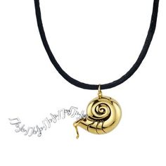 a necklace with a gold snail pendant on it's black leather cord, and an inscription