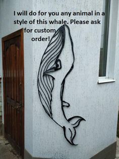 a drawing on the side of a building that says, i will do for you any animal in a style of this whale please ask for order