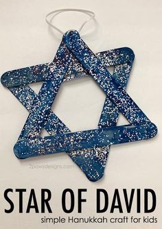 a star of david ornament made out of blue and white speckles