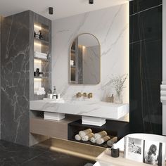 a bathroom with marble and gold accents