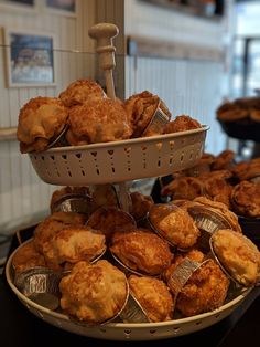 several trays of pastries are stacked on top of each other