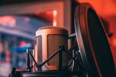 an old fashioned microphone sitting on top of a table