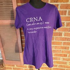 Women's Bartender T-Shirt In Purple. "Crna (See.Abr.En.Ey) Noun. A Very Expensive And Effective Bartender". Size L Pit To Pit Measures 22 Inches Length 27 Inches Qlp1 Fitted Graphic Tee With Name Print, Fitted T-shirt With Name Print And Short Sleeves, Fitted Short Sleeve T-shirt With Name Print, Fitted Purple T-shirt With Crew Neck, Purple Crew Neck Top With Name Print, Blue White Top, V Neck Tee, T Shirt Top, Color Purple