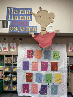 there is a large poster on the wall in the classroom that says llama llama red pajama