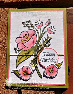 a happy birthday card with pink flowers on it