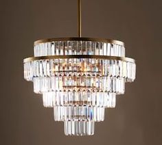 a crystal chandelier hanging from a ceiling in a living room or dining room