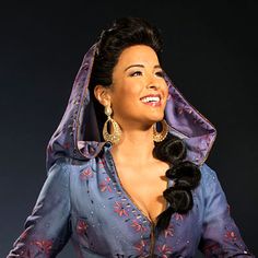 a woman dressed in an old fashion costume