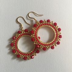 Red Crystal Seed Bead Hoop Earringsp Hoop earrings made with bright red velvety crystals with metallic gold 11/0 beads. The perfect Christmas holiday season earrings. Beautiful red crystals bead woven on a gold plated ring. The french hook earwires and findings are 14kt gold plated. These very lightweight measure 1.75 inches total. The beaded hoops are slightly over 1 inch. Great for anytime. I absolutely love this color and sparkle. Thanks for looking and please stop by again. 8 Red Beaded Earrings For Holiday, Red Beaded Earrings For Holiday With Round Beads, Small Hoop Beaded Earrings With Faceted Beads For Gift, Red Beaded Crystal Drop Earrings, Gift Small Hoop Beaded Earrings With Faceted Beads, Red Beaded Drop Crystal Earrings, Red Hoop Jewelry For Festive Occasions, Festive Red Hoop Jewelry, Red Faceted Beads Earrings For Festive Occasions