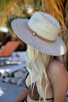 Handmade by artisans in Mexico, our new 100% baked palm leaf Islander Hat is perfect for spring and summer wear. Featuring a molded crown and tightly woven pressed palm, this hat offers the most sun protection. Embellished with a faux suede band and exclusive cut Swarovski crystals. - Hat is one size fits all and the band on the inside is stretchy. If you think you’ll want a tighter fit or have a smaller head, we can attach a foam piece behind the band to reduce the size. - Brim is 4” Adjustable Natural Sun Hat With Flat Crown, White Flat Crown Hat Bands For Beach, White Flat Crown Fedora For Beach, White Flat Crown Fedora For The Beach, White Flat Crown Sun Hat For Summer, White Flat Crown Straw Hat For Beach, White Flat Crown Panama Hat For Beach, White Panama Hat With Flat Crown For Beach, White Sun Hat With Flat Crown For Vacation