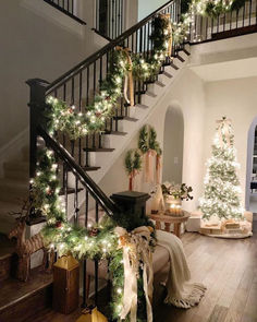 a staircase decorated with christmas trees and presents