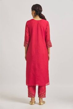 Red straight kurta with mirrors, thread, beads and sequin work embroidery. Comes with embroidered hem pant and dupatta.
Components: 3
Pattern: Embroidered
Neckline: Round
Sleeve Type: Three Quarter
Fabric: Organza, Muslin, Chanderi
Color: Red
Other Details: 
Attached lining
Back elasticated pant waistband
Length:
Kurta: 48
Pant: 37
Approx. product weight: 1 kg
Occasion: Puja - Aza Fashions Festive Pant Set With Embroidered Border For Diwali, Embroidered Pant Set For Diwali, Red Palazzo Set With Straight Kurta And Embroidered Border, Red Palazzo Set With Embroidered Border And Straight Kurta, Festive Embroidered Border Pant Set, Red Cotton Sets With Mirror Work, Elegant Red Palazzo Set With Embroidered Border, Traditional Festive Pant Set With Embroidered Border, Red Straight Kurta Pant Set For Eid