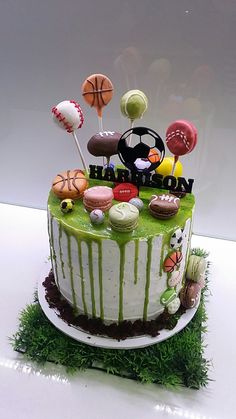 a birthday cake decorated with sports related items