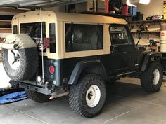 an off - road vehicle is parked in a garage