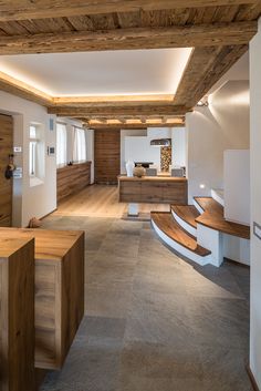 the interior of a modern house with wood accents