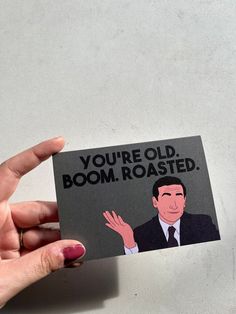 someone holding up a card that says you're old, boom roasted