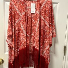 Ember Women’s Kimono/Cardigan Fringe Bottom Nwt Red & White Size Large 100% Polyester Casual Shawl Cardigan For Spring, Red Bohemian V-neck Outerwear, Casual Red Open Front Kimono, Red One-size Kimono For Fall, Red Open Front Top For Winter, Red Open Front Tops For Winter, One Size Red Kimono For Fall, Red Kimono For Fall, Spring Red Open Front Top