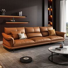 a living room with brown leather couches and lamps on the wall behind them,