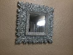 a mirror that is hanging on the wall