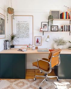 an office with a desk, chair and bookshelf