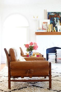 a living room filled with furniture and a fire place