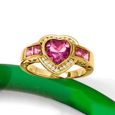 Ross-Simons - 3.20ct t. w. Pink Topaz, .18ct t. w. Diamond Heart Ring Over Sterling. Size 9. Stand out on date night with our glitzy ring! It flaunts a radiant 2.00 carat heart-shaped pink topaz accentuated by a sparkly halo of .18 ct. t. w. round diamonds and additional 1.20 ct. t. w. square pink topaz gems trailing either side. Crafted in 18kt yellow gold over sterling silver. 1/2" wide. Diamond and pink topaz heart ring. Luxury Diamond Ring With Gemstone For Valentine's Day, Valentine's Day Yellow Gold Diamond Ring With Center Stone, Valentine's Day Diamond Ring With Accent Stones, Formal Heart Ring With Center Stone For Valentine's Day, Valentine's Day Formal Heart Ring With Accent Stones, Formal Valentine's Day Heart Ring With Center Stone, Formal Diamond Ring With Accent Stones For Valentine's Day, Valentine's Day Formal Diamond Ring With Accent Stones, Valentine's Day Diamond Ring With Center Stone