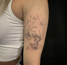 a woman with a tattoo on her arm that has an anime character drawn on it