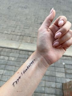 a woman's arm with a tattoo on it that says, i love you