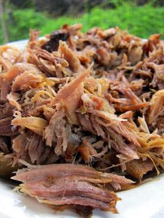 a white plate topped with meat and veggies