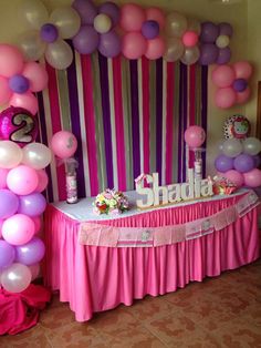 a birthday party with balloons and decorations