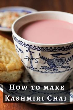 a cup of pink tea next to a biscuit on a plate with the words kashmiri chai