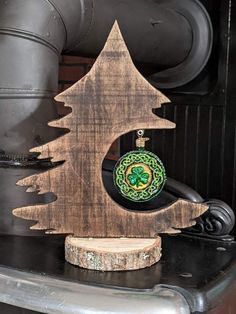 a wooden christmas tree decoration on top of a table