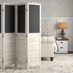 the room divider is made out of wood and has two panels on each side