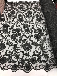 black and white lace with flowers on it