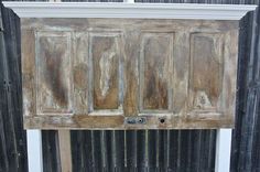 an old wooden door that has been painted white