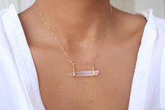 This dainty piece features a genuine Clear Quartz from my beautiful country Colombia and a dainty 18k gold-filled chain. A perfect necklace to wear anywhere and with any outfit. Choose your favorite chain length! Options: 16, 18, and 20 inches   GEMSTONE  * Clear Quartz is April's birthstone and is known as the stone of manifestation, clarity, and creativity. * Clear Quartz is approx. 28 mm in length. * Due to the one-of-a-kind nature of the stones, they may vary slightly in size, color, hue, an Delicate Everyday Crystal Pendant Necklace, Delicate Crystal Pendant Necklace For Everyday, Everyday Minimalist Gold Crystal Necklace, Delicate Everyday Crystal Necklace With Delicate Chain, Gold Bad, Crystal Yellow, Clear Quartz Necklace, Raw Quartz Crystal, April Birthstone Jewelry