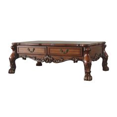 a wooden table with two drawers on one side and an ornate design on the other