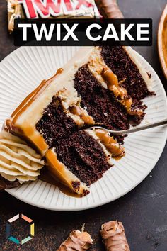 a slice of chocolate cake on a plate with caramel drizzle and candy bar in the background