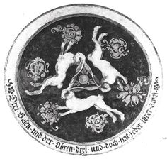 a black and white image of two dogs in a circle with flowers on the side